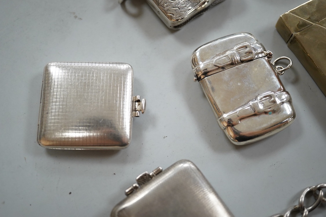 Three assorted silver vesta cases including one with a white metal chain, two gilded 900 standard white metal vesta cases, designed as a letter with postage stamp, 60mm, one 925 vesta case modelled as a satchel and two s